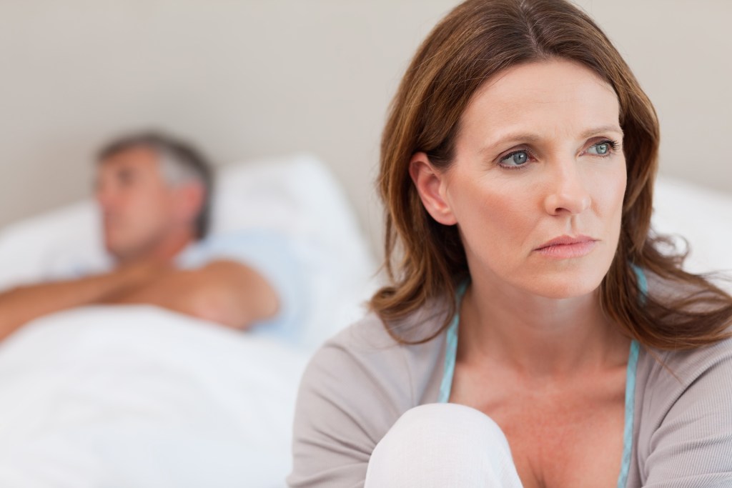 Woman concerned and frustrated by intimacy issues in her relationship