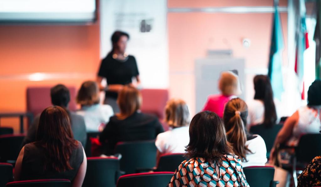 A woman representing sex therapist Andi Grushka speaking in front of an audience at a conference for sex therapists and sexual health